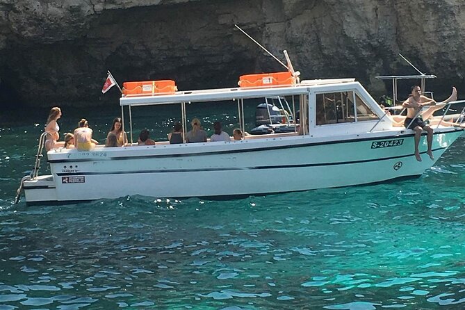 Comino and Gozo Private Boat Tour : Julie Pearl Boat - Passing Elephant Rock and entering Santa Maria Caves
