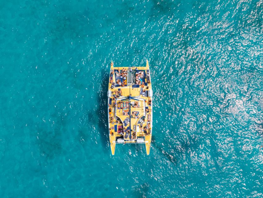 Comino: Blue Lagoon Catamaran Cruise with Lunch and Open Bar - Swimming at the bays around Comino