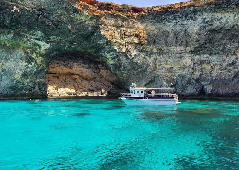 Comino: Blue Lagoon, Crystal Lagoon and Sea Caves Boat Tour - Leaving Ċirkewwa and passing Comino Tower