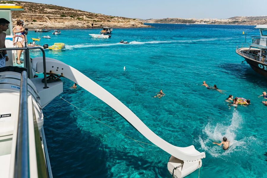 Comino: Blue Lagoon, Crystal Lagoon, and Seacaves Tour - Life onboard: comfort, food, and the waterslide