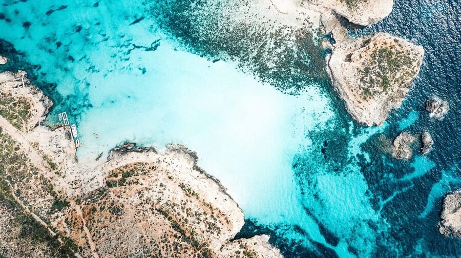 From Mellieha: Three Bay Cruise including the Blue Lagoon - Blue Lagoon: beautiful water, busy shoreline