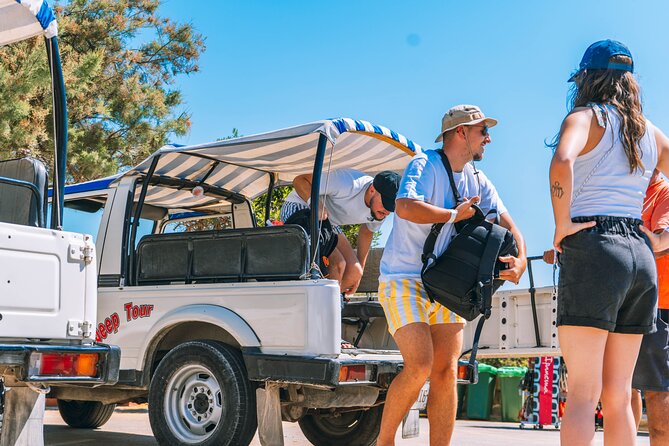 Gozo Full-Day Jeep Tour with Private Boat to Gozo & return - Xlendi Bay, cliffs, and village views