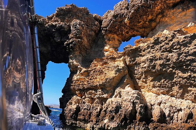 Half Day Malta Tour to Gozo Comino and Blue Lagoon Caves - Blue Lagoon: famous, beautiful, and crowded