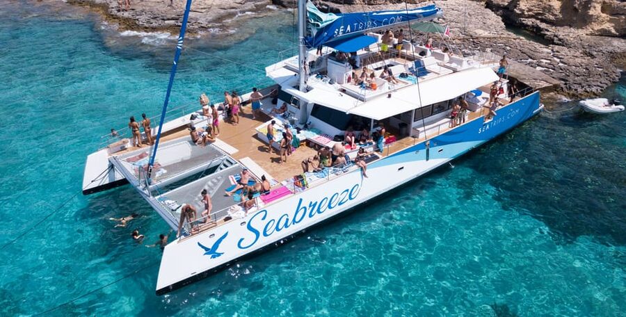 Malta: Blue Lagoon Evening Catamaran Cruise - Crystal Lagoon brings cliffs, caves, and deeper water