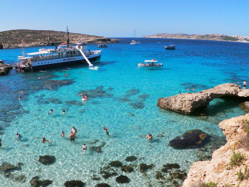 Malta: Comino, Blue Lagoon, Crystal Lagoon & Caves Cruise - The slide, swimming platforms, and upper deck
