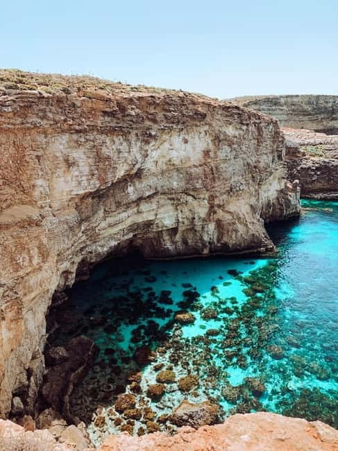 Malta: Private Boat Cruise with Caves, Beaches & Swim Stops - Finding the boat behind Cirkewwa Cafe