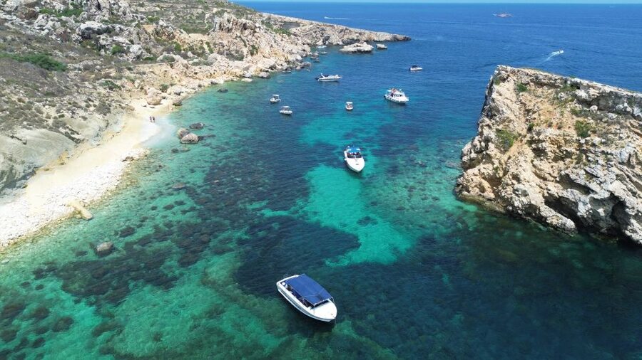 Sliema: Boat Trip to Comino Blue Lagoon, Gozo, and Caves - Crystal Lagoon: the first jump into the sea