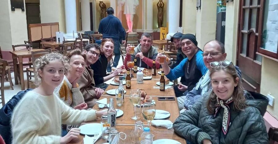 Valletta: Food Walking Tour with Tastings - Walking Republic Street with food in hand