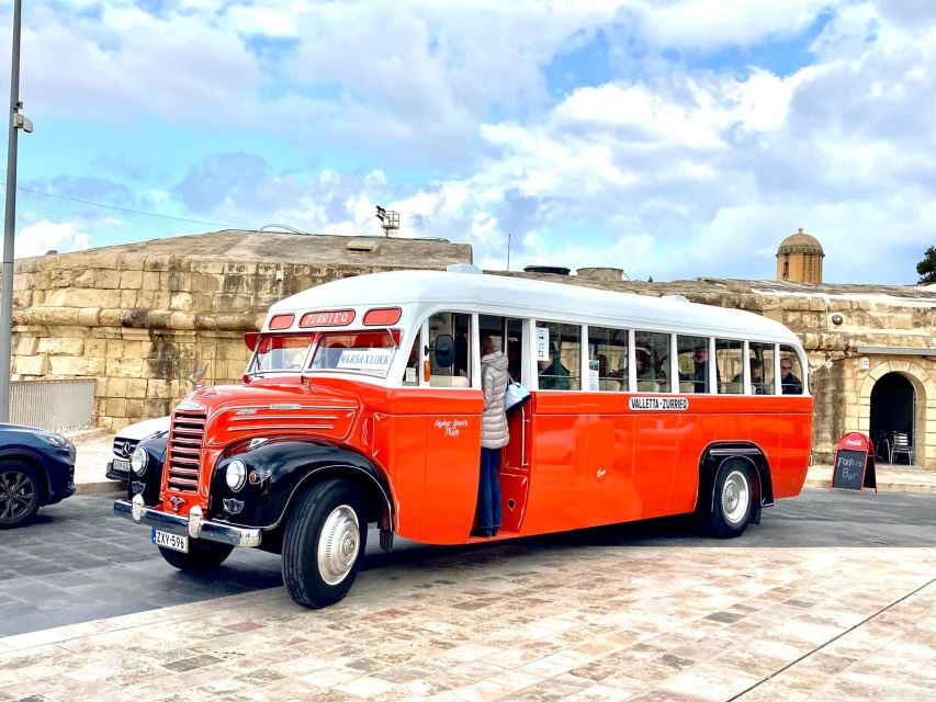 Valletta: Sunday Vintage Bus to Marsaxlokk - Leaving Valletta near Triton Fountain